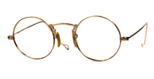Antike runde Brille aus Golddoublé mit ziseliertem Nasensteg. Aus den 30er Jahren, in 12 Karat