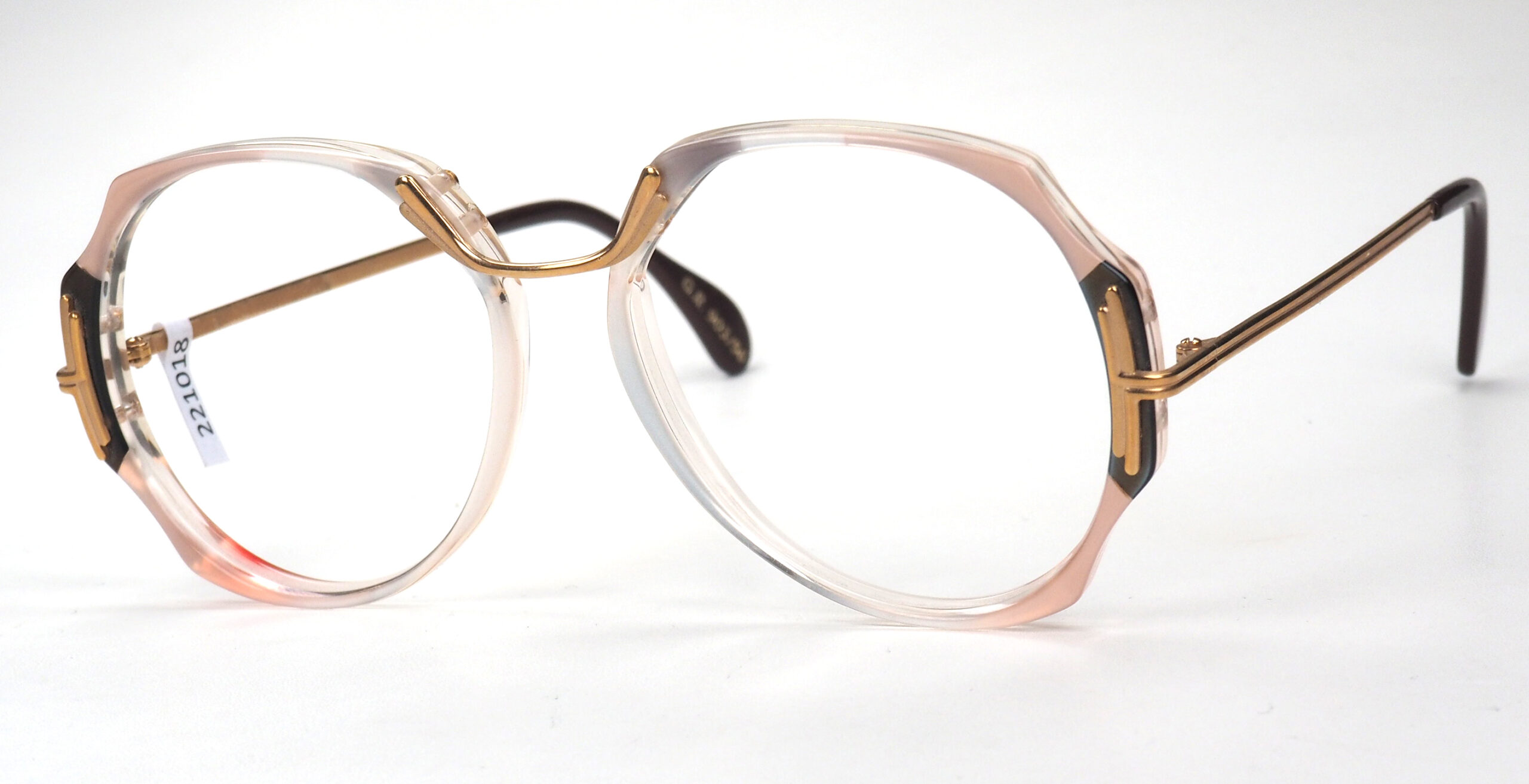 Vintagebrille der 80er Jahre, perlmuttschillernd mit Metallsteg und Dekor