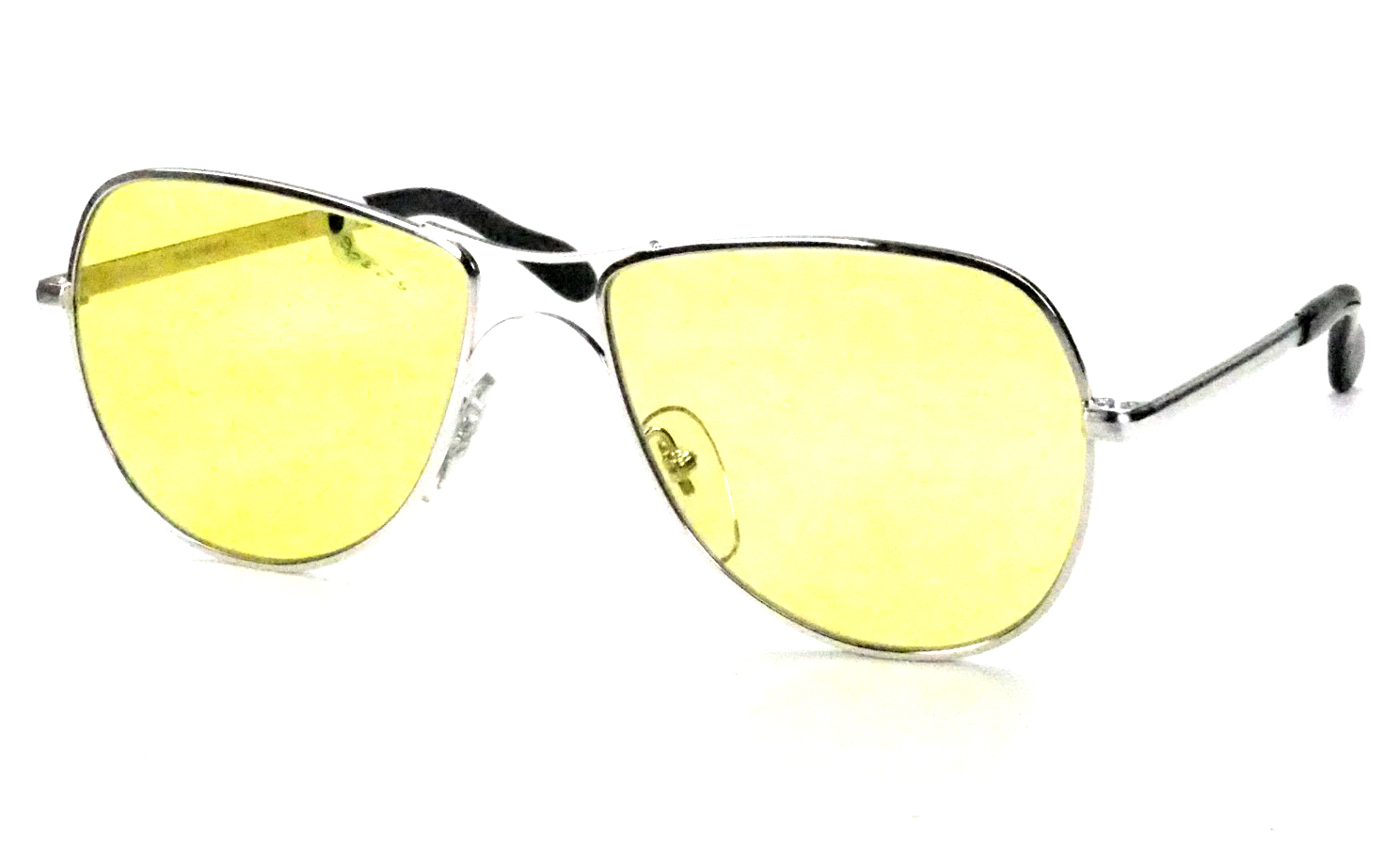 Vintage Sonnenbrille aus den 80er Jahren, in silber und mit gelben Kunststoffgläsern